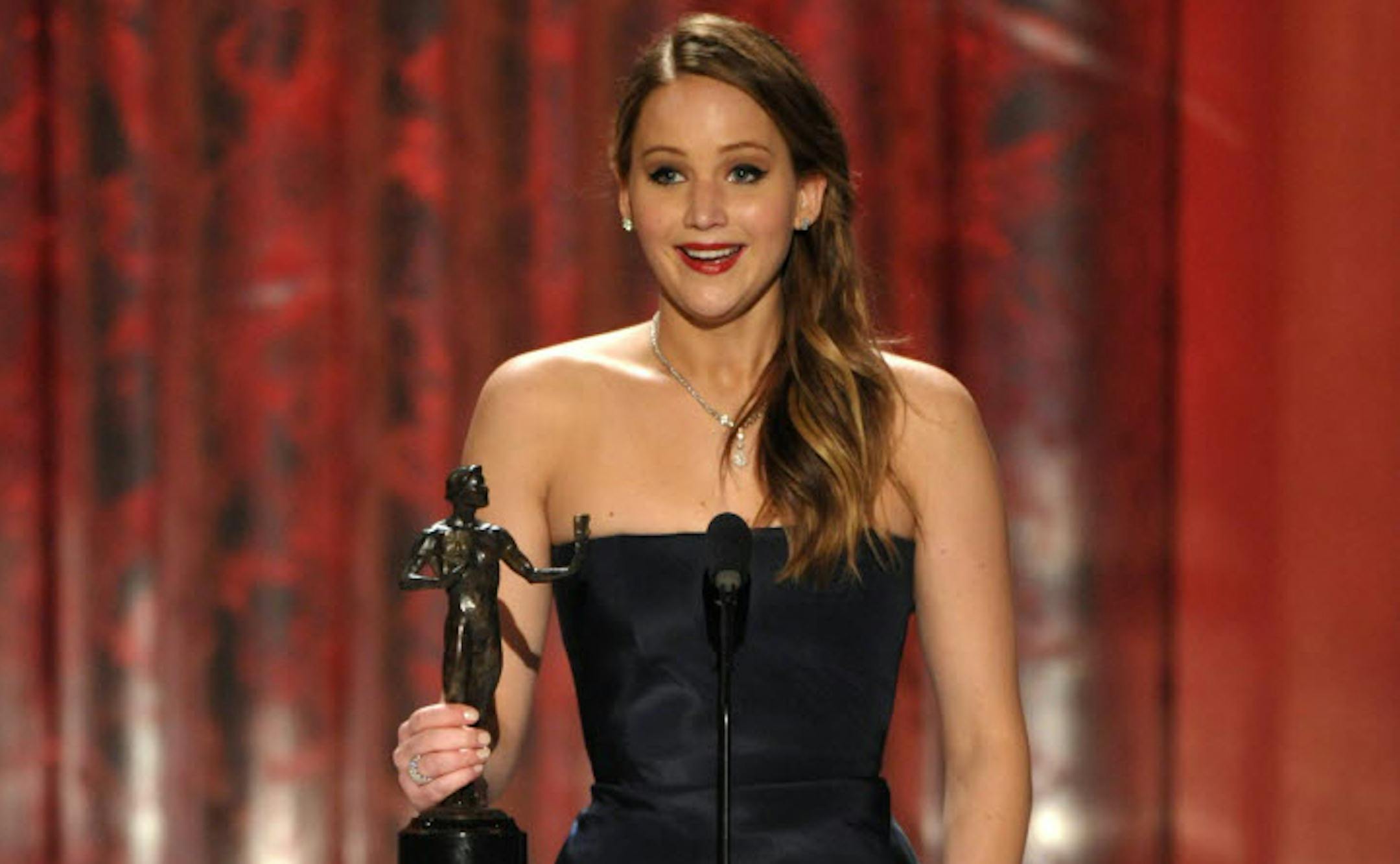 Jennifer Lawrence accepts the award for outstanding female actor in a leading role for "Silver Linings Playbook" at the 19th Annual Screen Actors Guild Awards.