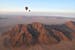 The attached is a photo of my husband and I on a hot air balloon ride on the Kulala Wilderness Reserve in Namibia Africa on September 2017. We took a 