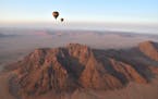 The attached is a photo of my husband and I on a hot air balloon ride on the Kulala Wilderness Reserve in Namibia Africa on September 2017. We took a 