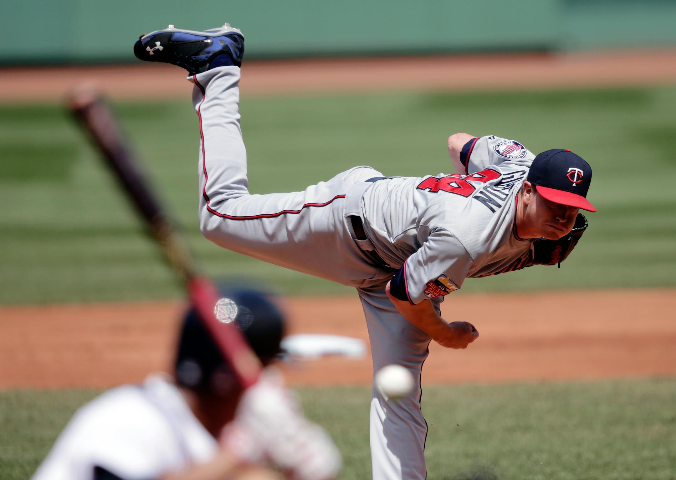 Minnesota Twins starting pitcher Kyle Gibson delivers to the Boston Red Sox during the first inning of a baseball game at Fenway Park in Boston, Wednesday, June 18, 2014. (AP Photo/Charles Krupa)