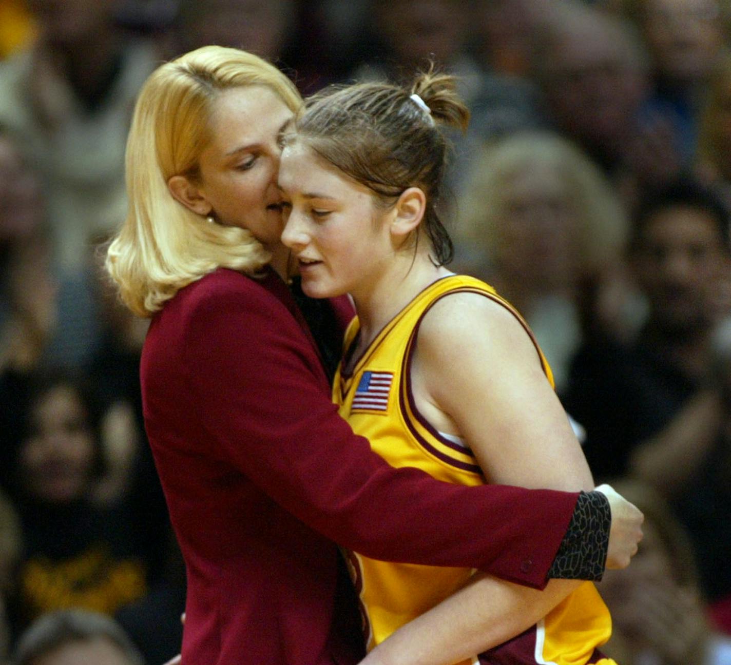 Coach coach Brenda Oldfield (now Frese) hugged Lindsey Whalen after a win over Purdue in 2002. Now, Frese is at Maryland and Whalen is coach of the Gophers