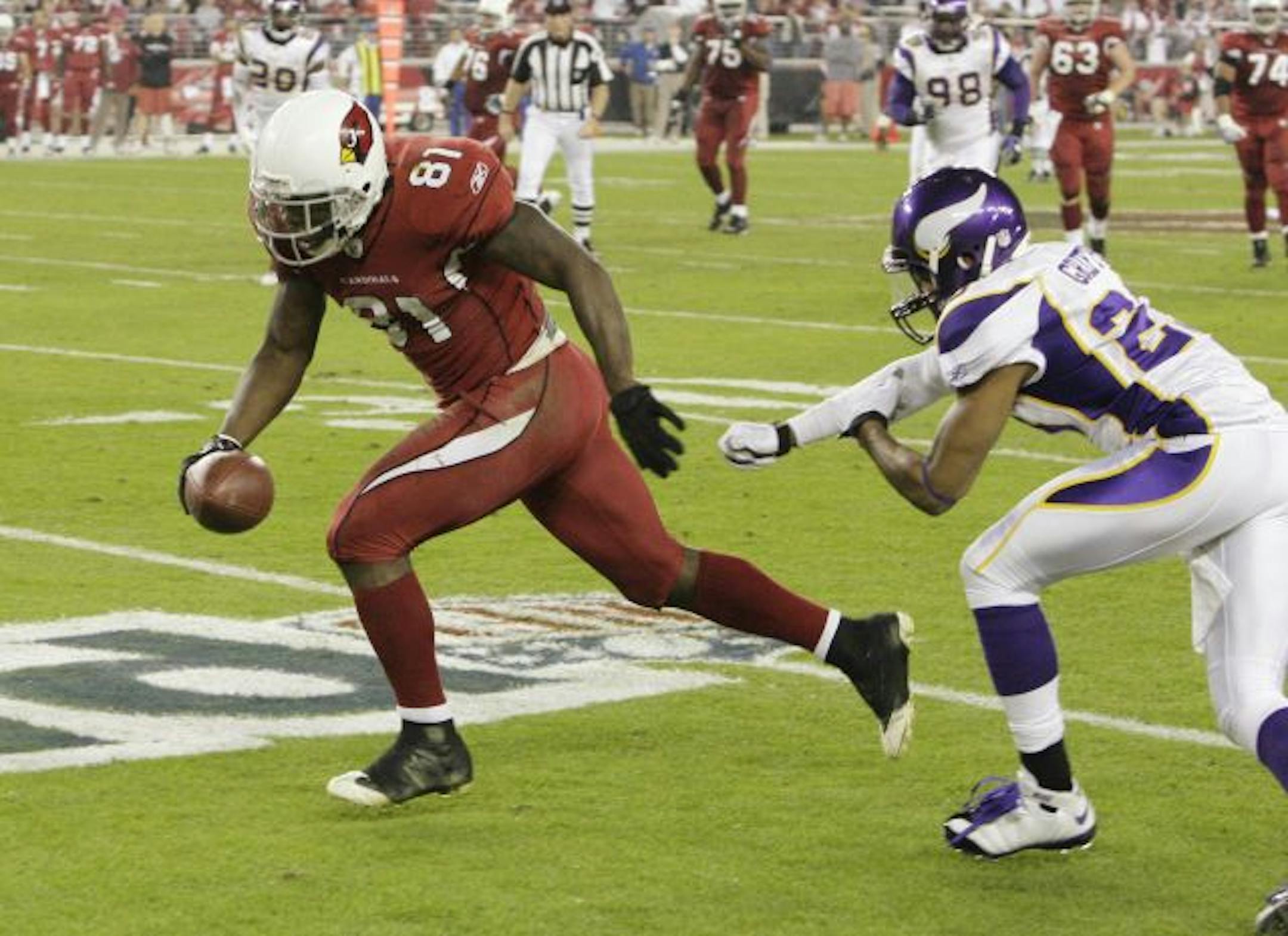 Arizona Cardinals' Anquan Boldin (81) gets past Minnesota Vikings' Cedric Griffin and heads for a touchdown in the second quarter during an NFL football game Sunday, Dec. 6, 2009, in Glendale, Ariz.