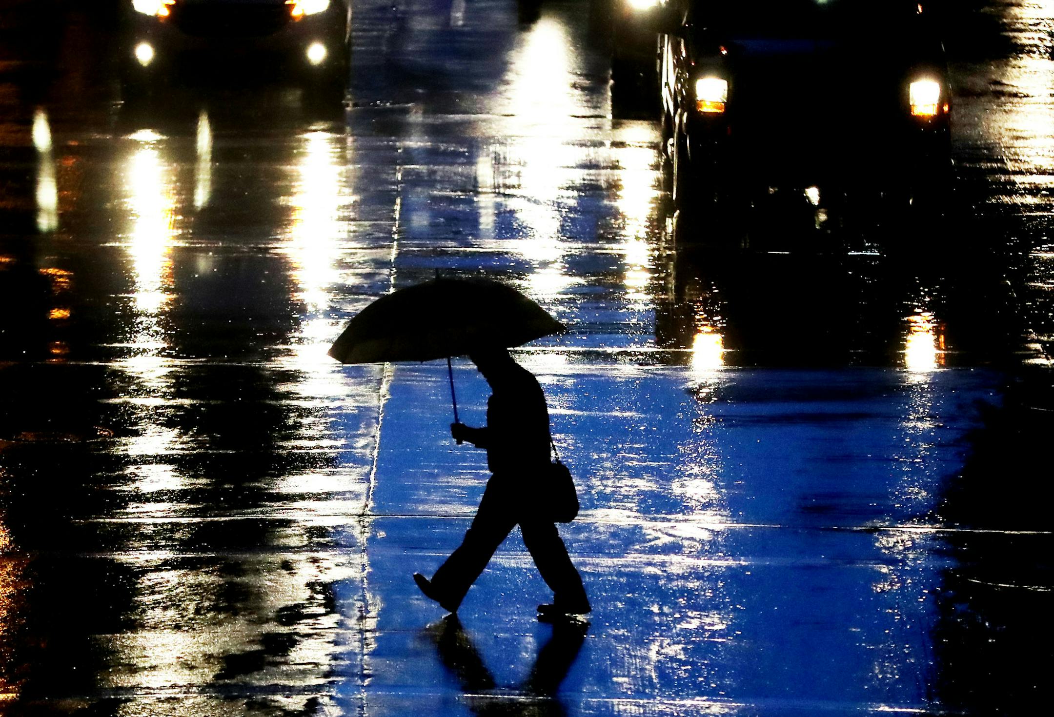 Rain fell on a pedestrian crossing S. 6th Street Tuesday Sept. 6, 2016, in downtown Minneapolis, MN.(DAVID JOLES/STARTRIBUNE)djoles@ Mpls North at Washburn Heavy rains fell early this morning and are expected to continue on and off into Wednesday, with the possibility of localized flooding in some areas already saturated by late-summer rainfall.