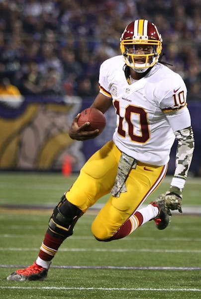 Redskins quarterback Robert Griffin III scrambled to his right and threw an incomplete touchdown pass to wide receiver Pierre Garcon in the first quar