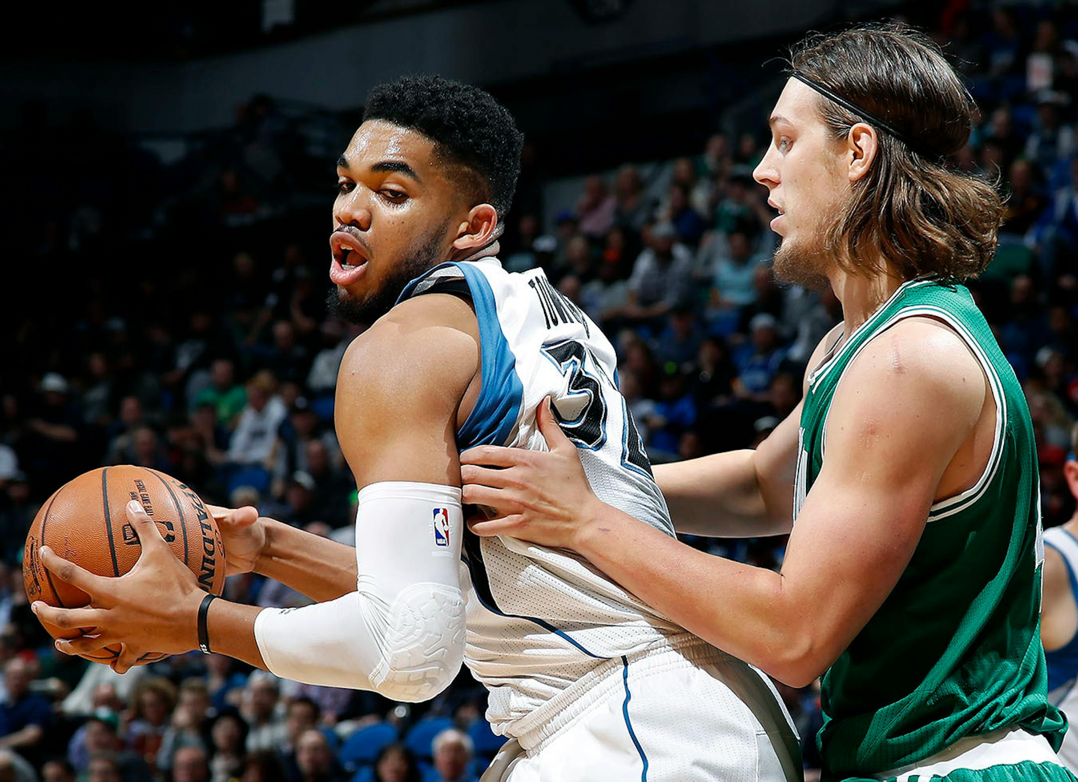 Karl Anthony Towns was defended by Kelly Olynyk in the third quarter.