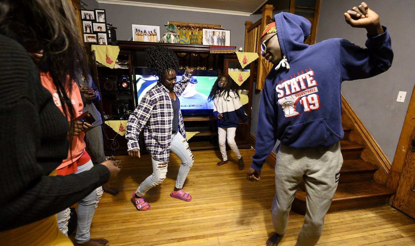 Agwa Nywesh and his family broke out into dancing to Ethiopian Music after eating their Thanksgiving feast Thursday night at their home. ] Aaron Lavinsky &#x2022; aaron.lavinsky@startribune.com Photos to accompany a feature on the ethnic diversification of Austin Minn., as seen through the Austin High School boys basketball and soccer programs, photographed Thursday, Nov. 28, 2019.