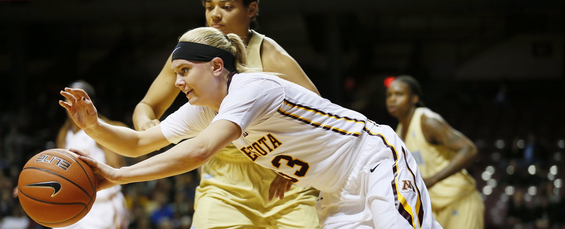 Minnesota Golden Gophers guard Carlie Wagner (33) sprinted too a loose ball with Southern University Jaguars guard Britney Washington (21).