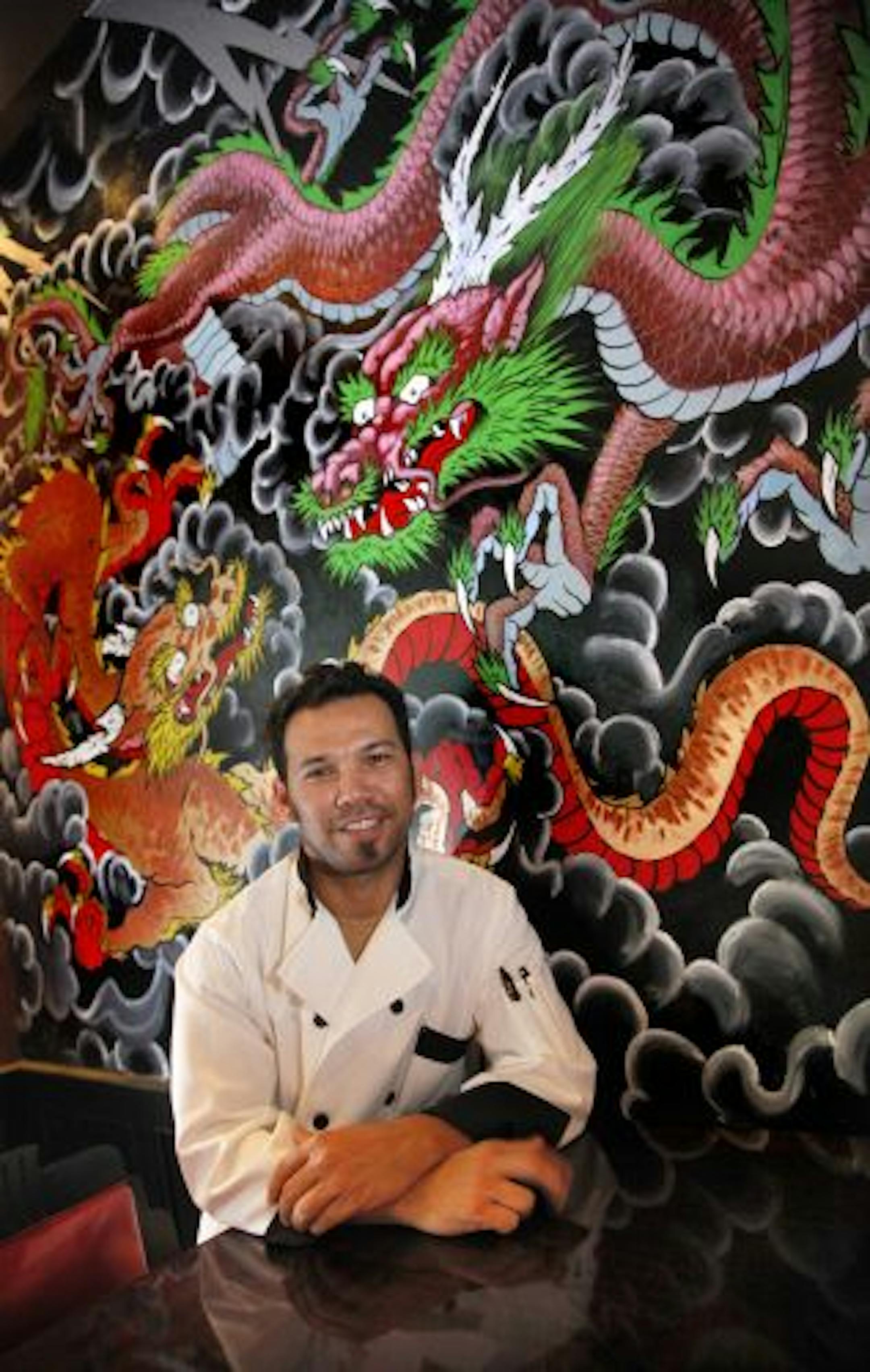 Thom Pham in front of the new addition to the decor.