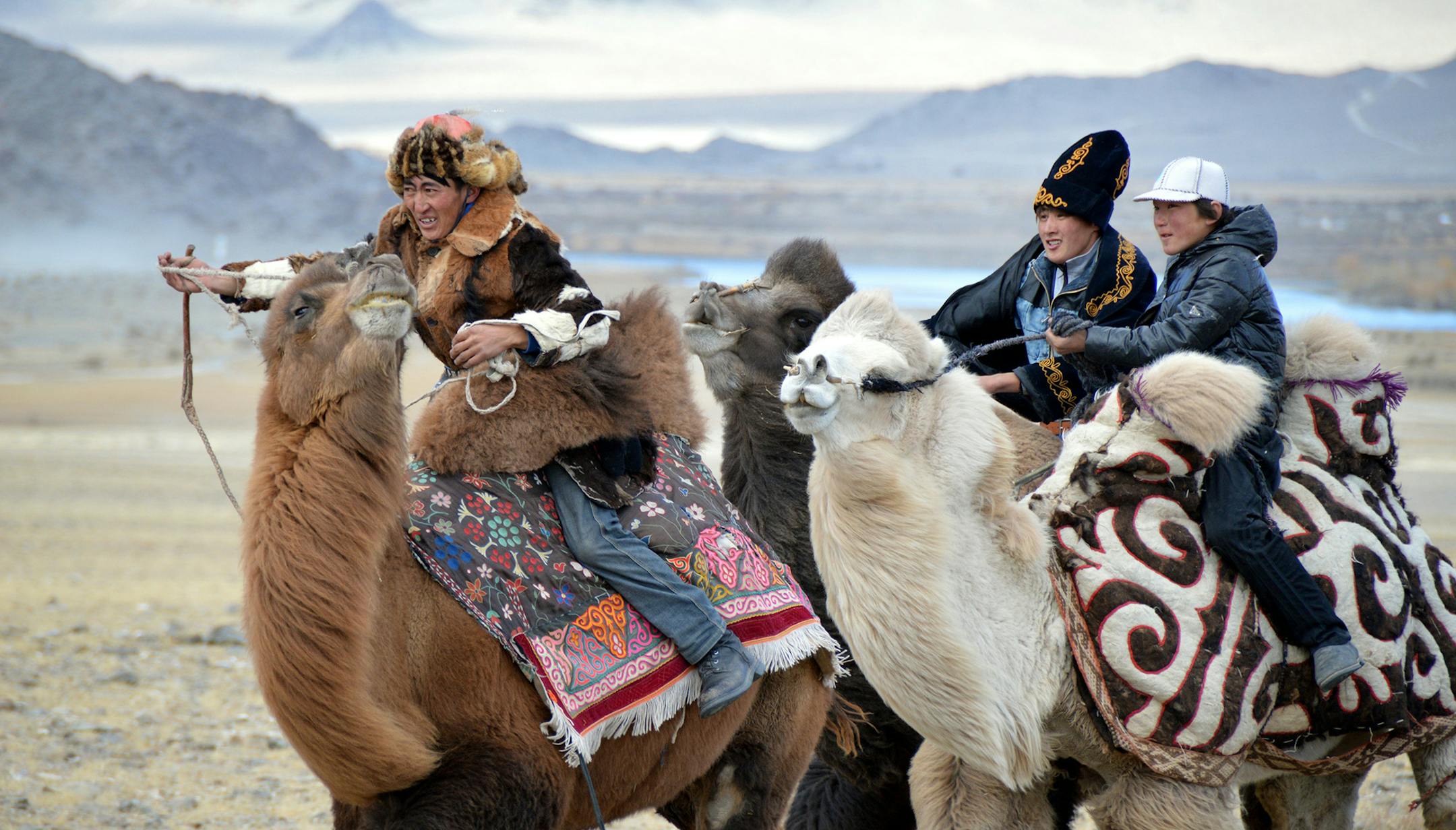 7) Three participants in the camel race in the games at the Eagle Hunting Festival in Ulgii, Mongolia, in October 2014.