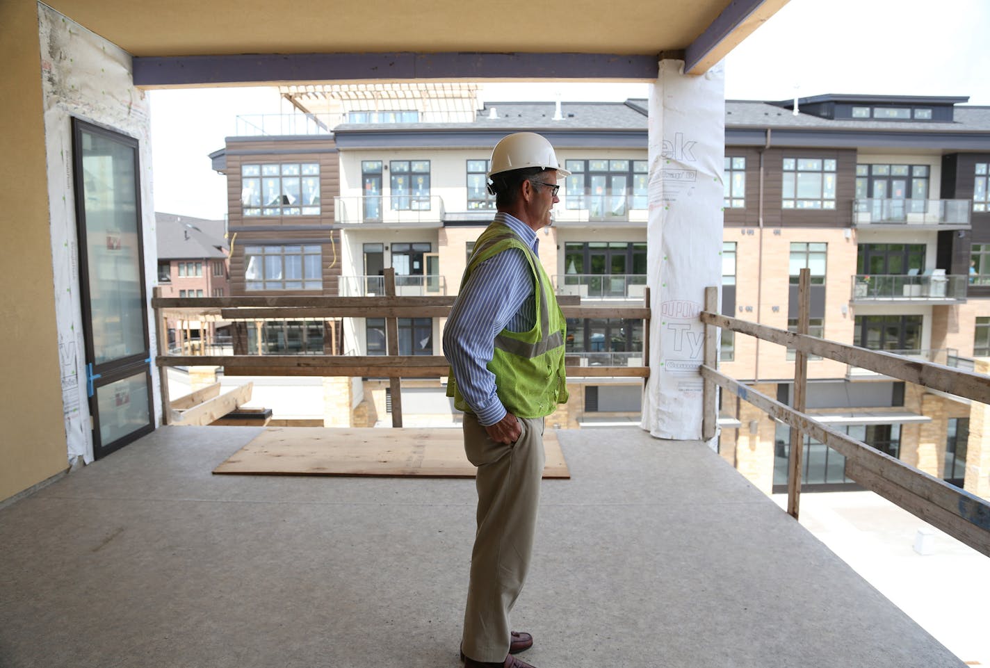 Developer Steve Bohl, who is helping to return hotels to Lake Minnetonka, walked through one of the apartments under construction in the new senior building at his proposed complex along the lake in Wayzata. The complex will have a senior home, a condo and a hotel with a green space in front of it.