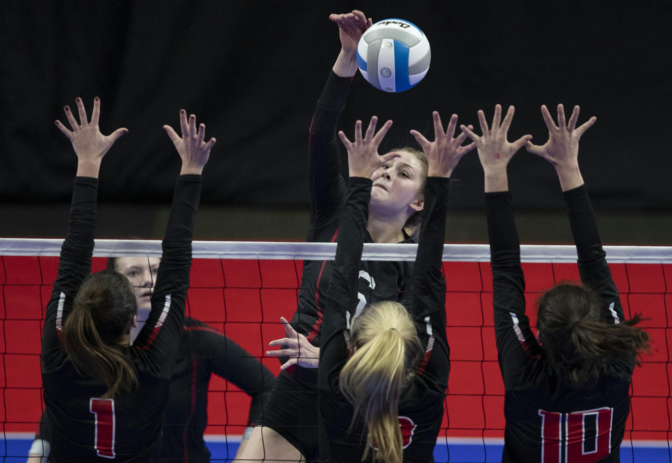 Reece Koehler spiked the ball over Shakopee defenders in 3A volleyball quarterfinals at Xcel Center Thursday November 8, 2018 in St. Paul, MN.] Jerry Holt ï Jerry.holt@startribune.com