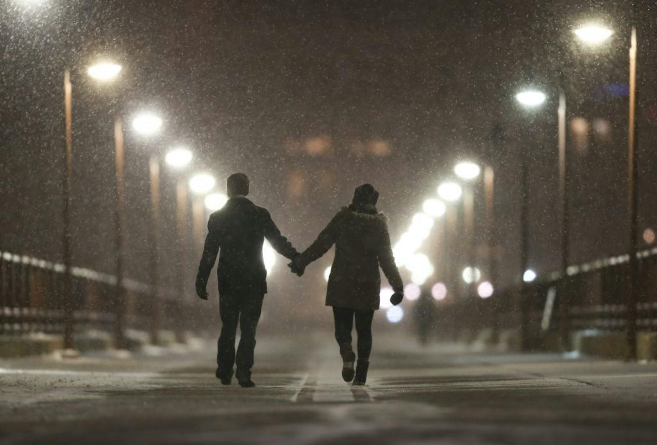 Peter Best and Mackenzie Kuhl went for a snowy stroll across the Stone Arch Bridge Monday night.