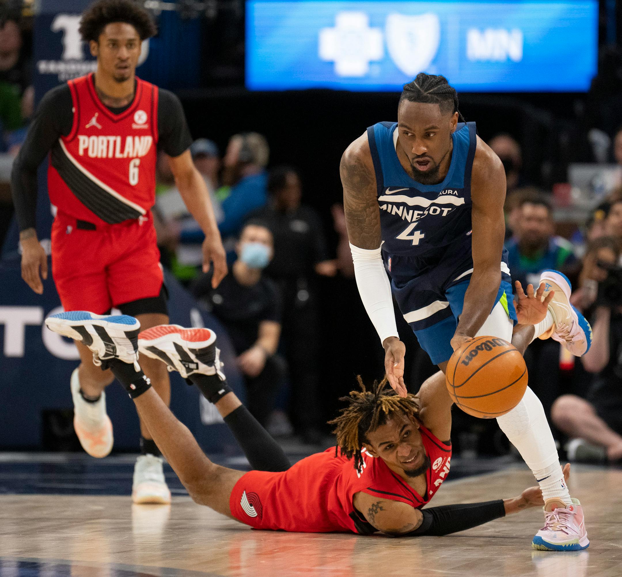 Minnesota Timberwolves guard Jaylen Nowell (4) gained control of a loose ball that eluded Portland Trail Blazers forward Greg Brown III (4) in the first quarter.