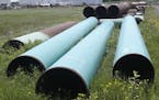 FILE - In this June 29, 2018 file photo, pipeline used to carry crude oil is shown at the Superior terminal of Enbridge Energy in Superior, Wis. An up