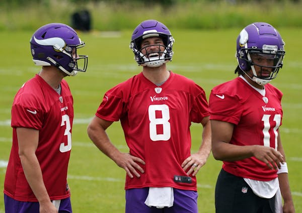 Minnesota Vikings quarterback Kirk Cousins (8) laughed along with his fellow quarterbacks Jake Browning (3) and Kellen Mond (11).