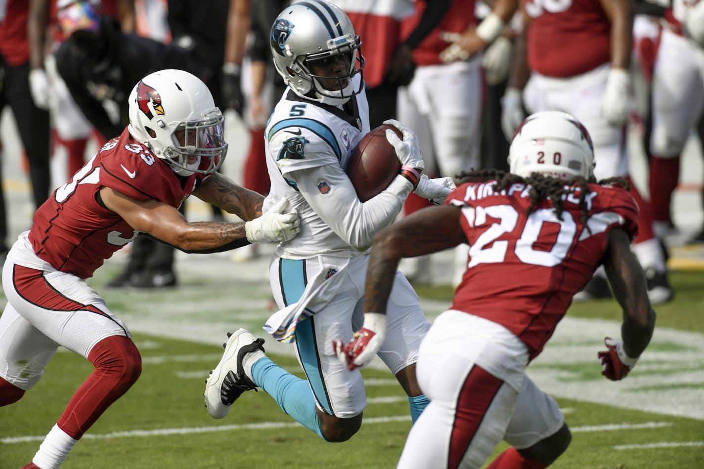 Carolina Panthers quarterback Teddy Bridgewater runs between Arizona Cardinals cornerback Byron Murphy, left, and cornerback Dre Kirkpatrick during the second half of an NFL football game Sunday, Oct. 4, 2020, in Charlotte, N.C. (AP Photo/Mike McCarn)