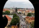 Charles Bridge and its sea of tourists is visible from the Old Town Hall and astronomical clock tower. DAVID JOLES &#xef; david.joles@startribune.com