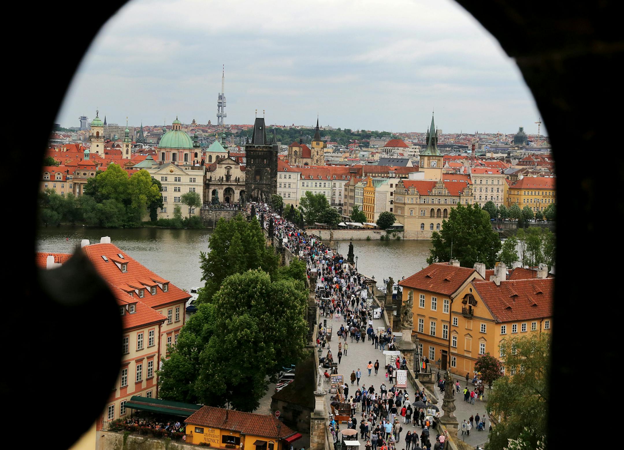 Charles Bridge and its sea of tourists is visible from the Old Town Hall and astronomical clock tower. DAVID JOLES ï david.joles@startribune.com