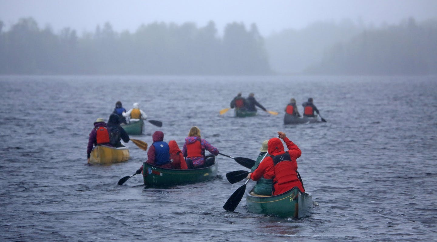 Not since the battle of 1978 to designate the BWCA as a wilderness area has the town of Ely been so divided. This time it's the possibility of Copper/Nickel mining and the promised jobs it brings -vs- the fear that mining so close to the BWCA could contaminate the water. Here, Supporters of Sustainable Ely held their Celebrate the Kawishiwi River paddle on Saturday, despite the 45 degree temp and poring rain, the event attracted about 50 paddlers. The paddle followed the grand opening of the Sus