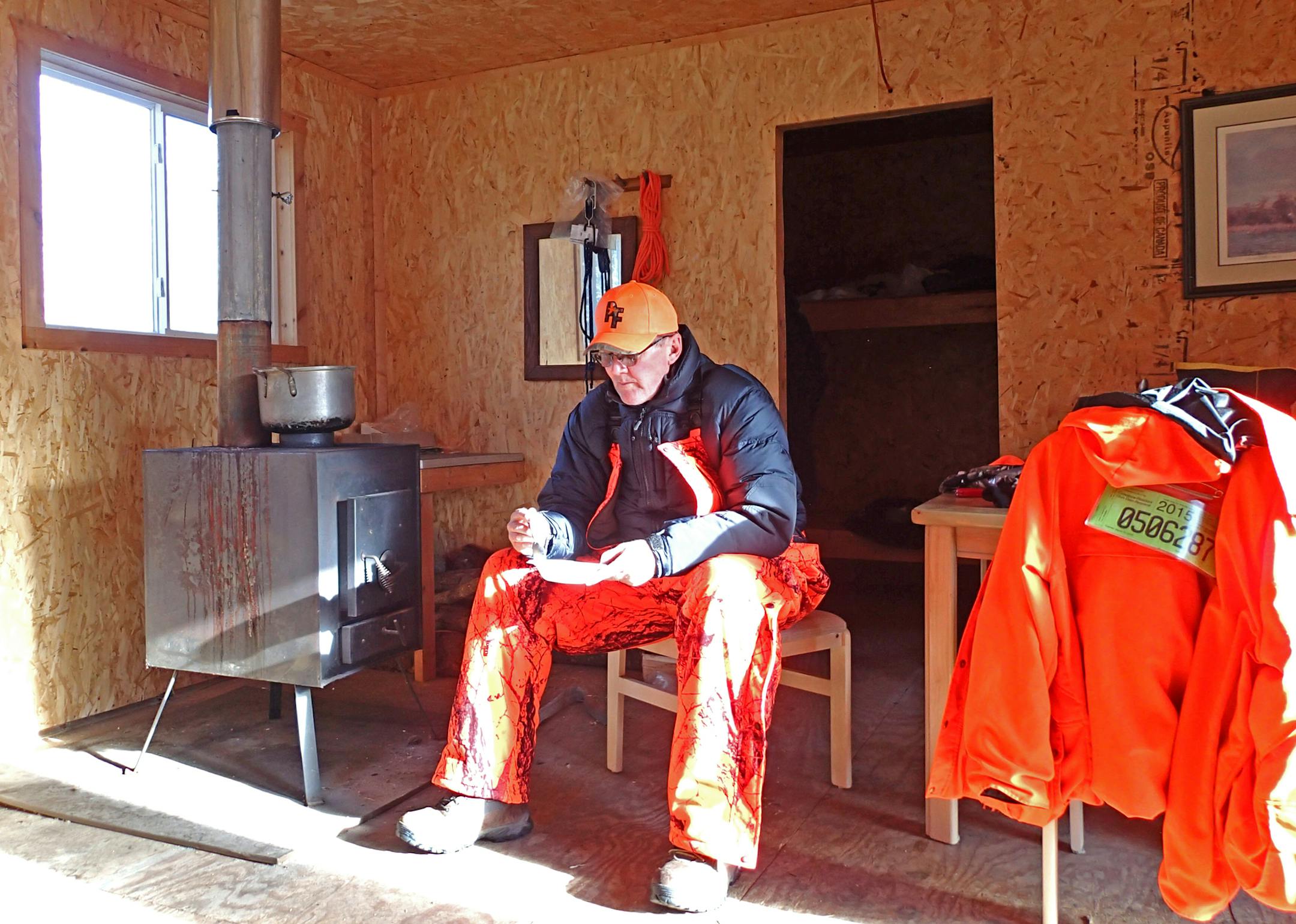 Above:  Lunch was a bowl of soup consumed alongside the wood stove that heats Anderson’s home away from home during Wisconsin’s deer season.