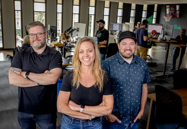 Parallax CEO Tom O’Neil, right, with company leaders Amanda Anderson and Dave Annis. The company raised $12 million in June to grow its software tha