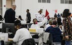 Workers count absentee ballots in Detroit, Nov. 4, 2020. While the nation awaits final results from Pennsylvania, Arizona and other key states, it is 