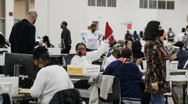 Workers count absentee ballots in Detroit, Nov. 4, 2020. While the nation awaits final results from Pennsylvania, Arizona and other key states, it is 