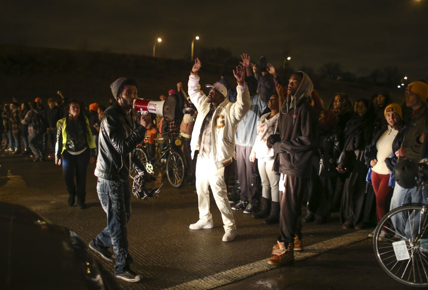 Protesters stood on I-94 north of Plymouth Avenue, shutting it down Monday night in Minneapolis.