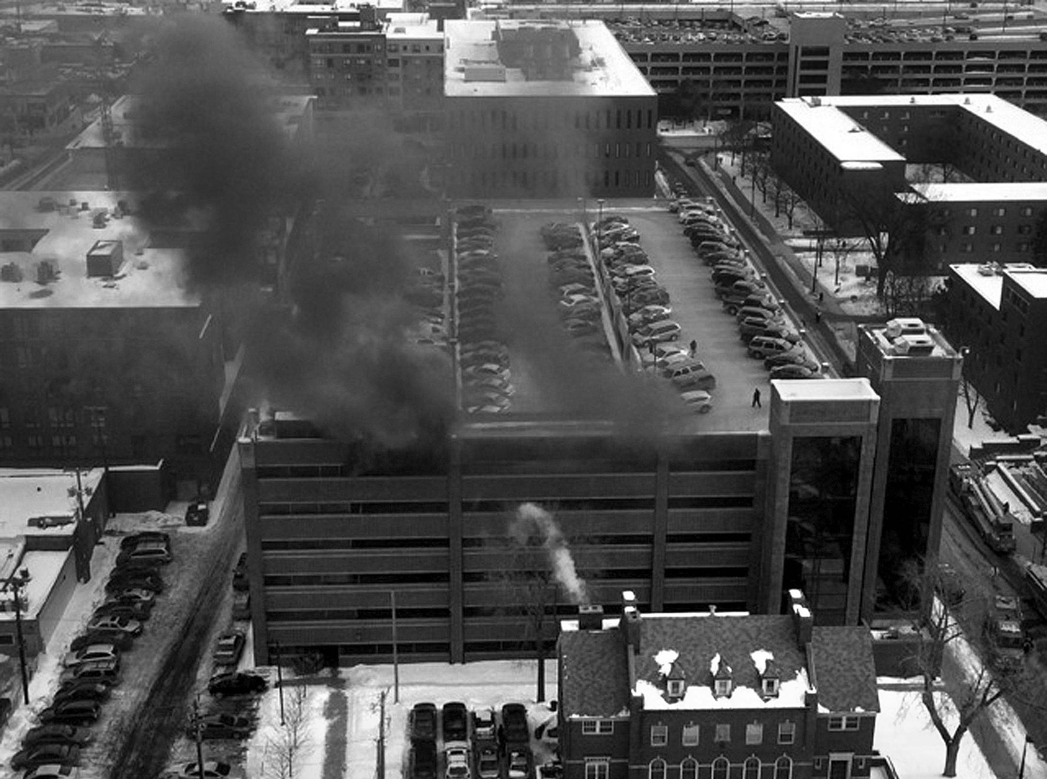 Several cars burned Tuesday, Jan. 21, 2014, at a parking ramp that serves the University of Minnesota Medical Center, Fairview, in Minneapolis. (Photo: Jos‚àö¬© Maldonado, Special to the Star Tribune ORG XMIT: MIN1401211642390791