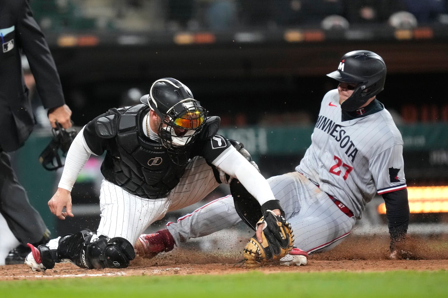 Chicago White Sox catcher Yasmani Grandal forces Minnesota Twins' Ryan Jeffers out at home off a throw from shortstop Tim Anderson during the seventh inning of a baseball game on Wednesday, May 3, 2023, in Chicago. (AP Photo/Charles Rex Arbogast)