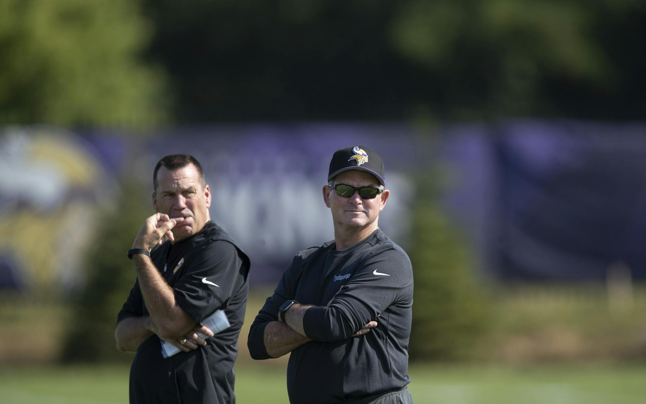 Vikings head coach Mike Zimmer right and Gary Kubiak watched the team during the first day of training for Vikings rookies at TCO Performance Center July,23 2019 in Eagan, MN.