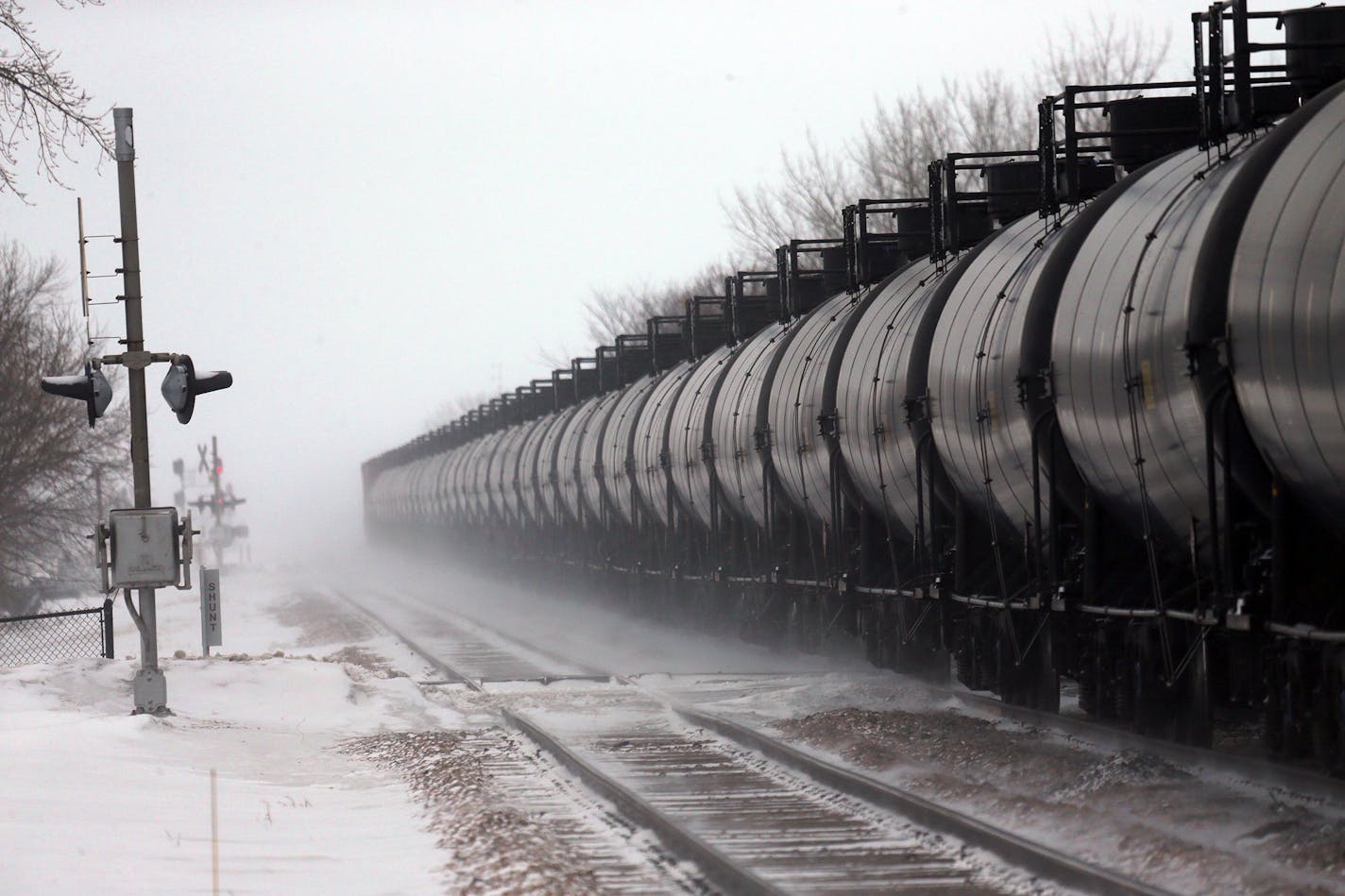 Cars on an oil train roll through Casselton, N.D., Jan. 16, 2014. A fiery rail accident last month in Casselton, N.D., which prompted residents to evacuate the town, has shattered people's confidence in the crude-oil convoys that rumble past seven times a day. (Jim Wilson/The New York Times) ORG XMIT: MIN2014021414074052 ORG XMIT: MIN1402141411212271