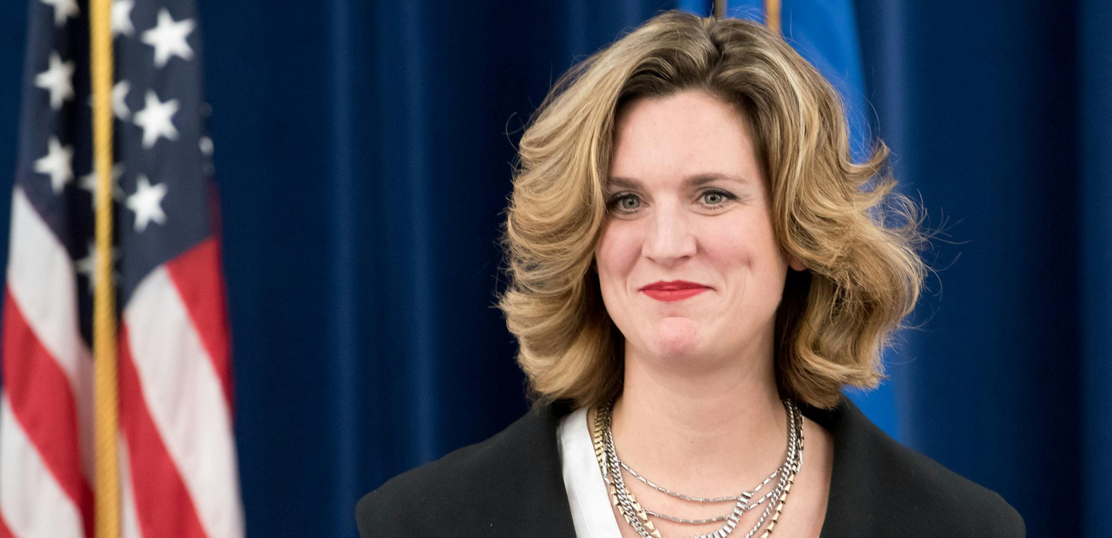 Emily Johnson Piper smiles during a news conference where Lt. Governor Tina Smith announced that she is the new Department of Human Services commissioner, Monday, Dec. 7, 2015 in St. Paul.
