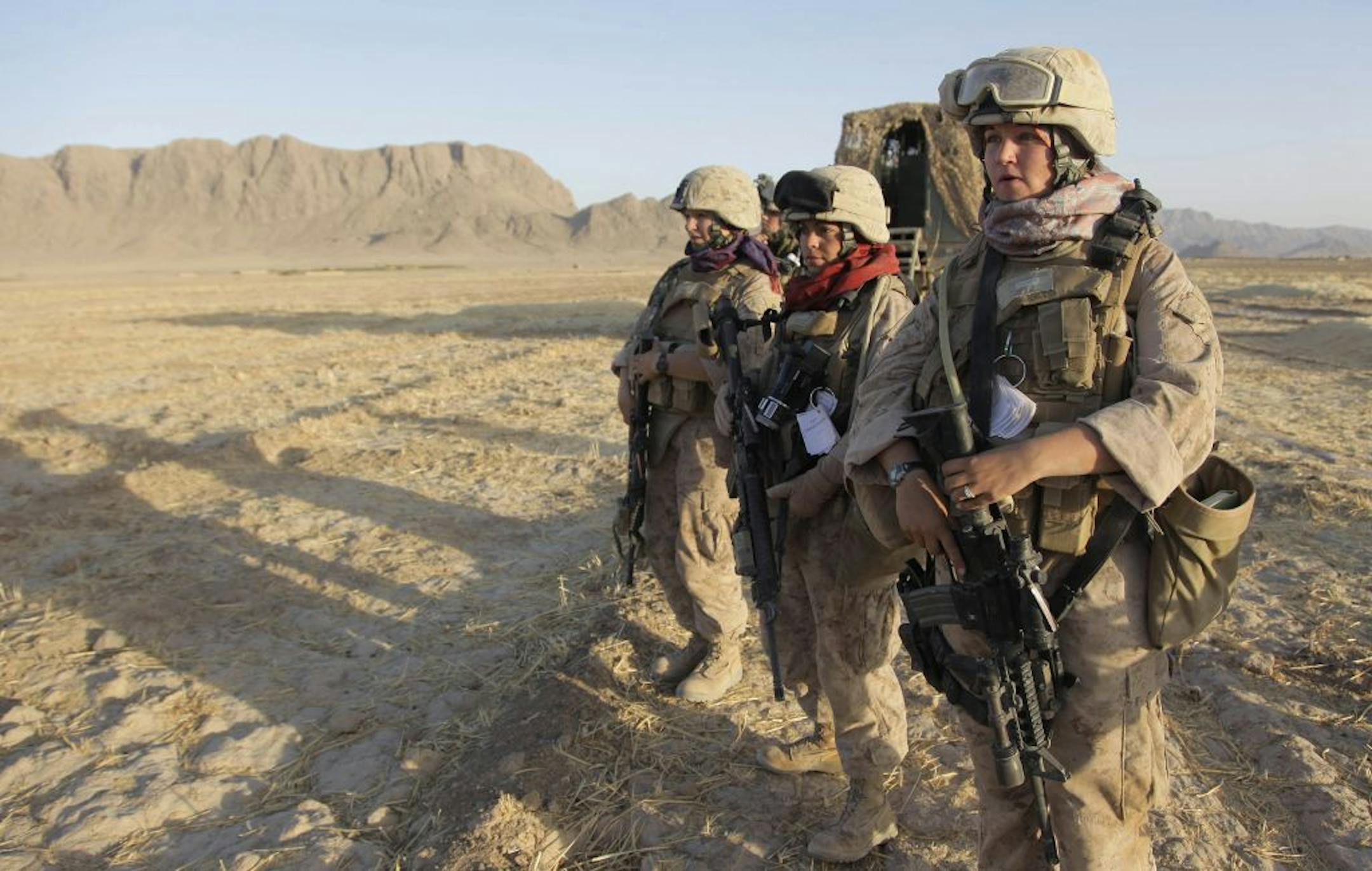 U.S. Marine Female Engagement Team members waited for the signal to begin their patrol in Afghanistan's Helmand Province. The Pentagon's shift acknowledges that the battle lines have changed; that war is no longer a line of fighters heading to combat but that anyone who leaves a base is exposed to combat.