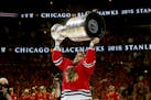 Chicago Blackhawks right wing Kris Versteeg (23) celebrates with the Stanley Cup Monday, June 15, 2015 after defeating the Tampa Bay Lightning in Game