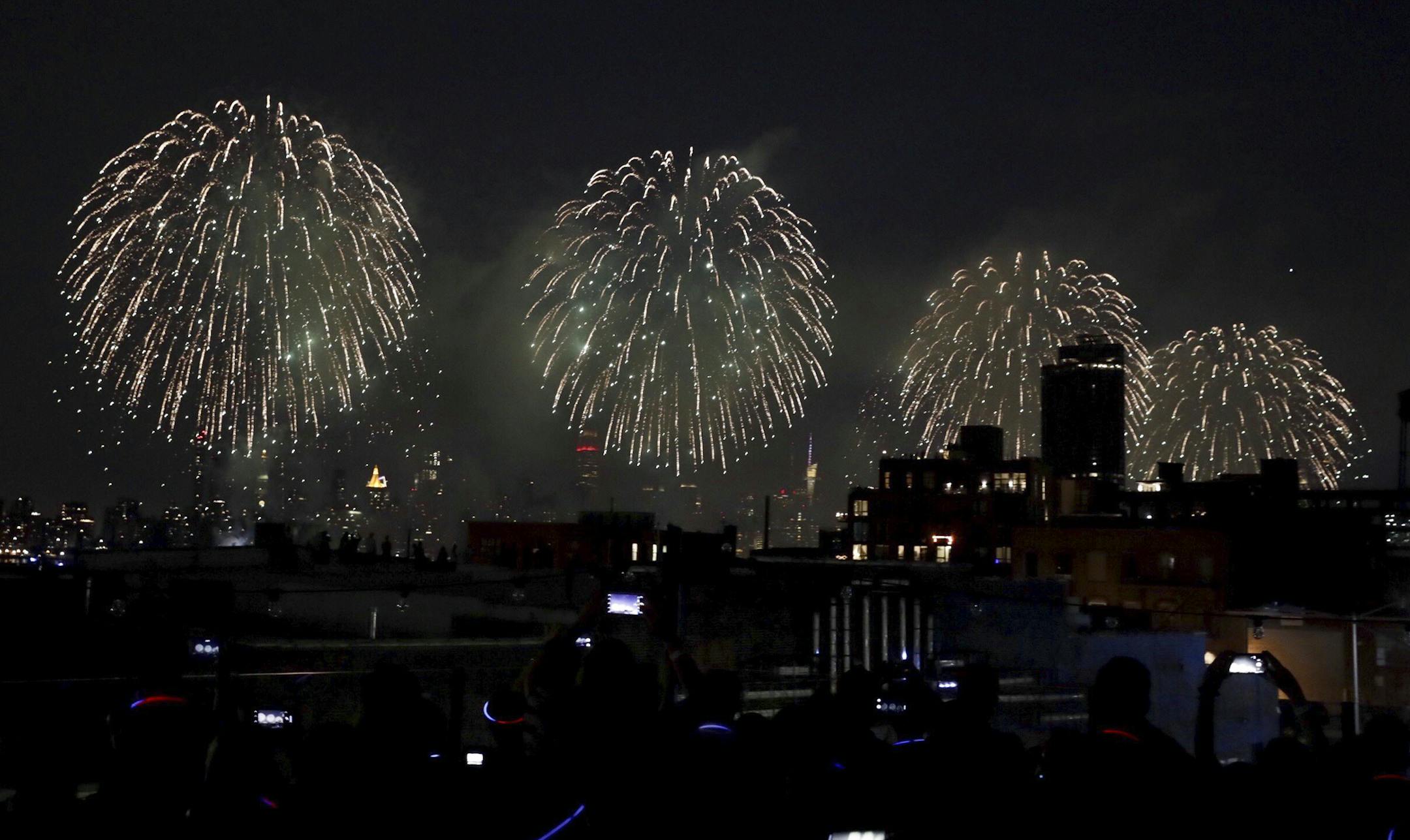 The Macyís Fourth of July Fireworks Show launched over the East River as seen from Brooklyn, July 4, 2018. (Jeenah Moon/The New York Times)