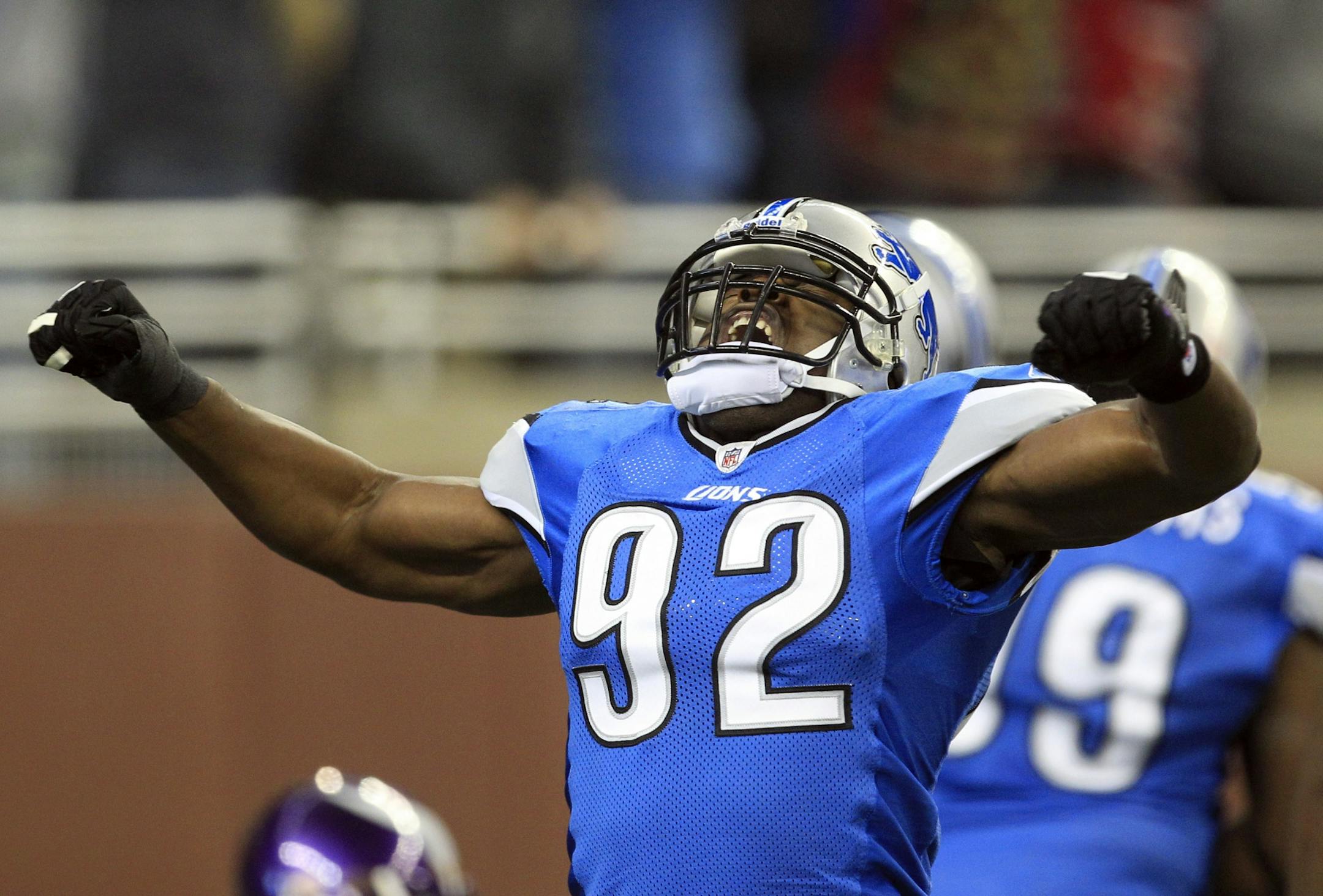 Detroit Lions defensive end Cliff Avril (92) reacts after the Lions scored a touchdown against the Minnesota Vikings during the first quarter of an NFL football game in Detroit, Sunday, Dec. 11, 2011.