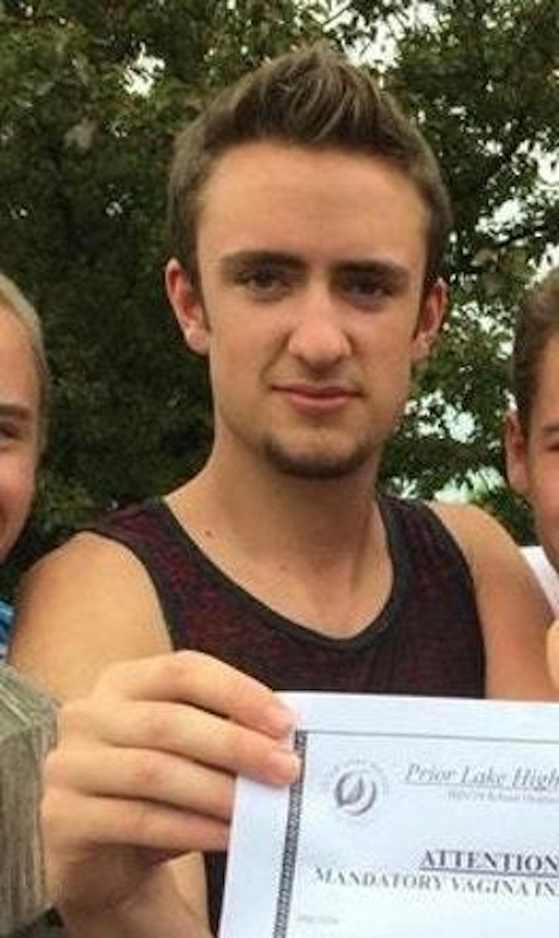 This photo of Benjamin Sloan, standing among other teens, was posted on Twitter and showed them holding a prank letter.