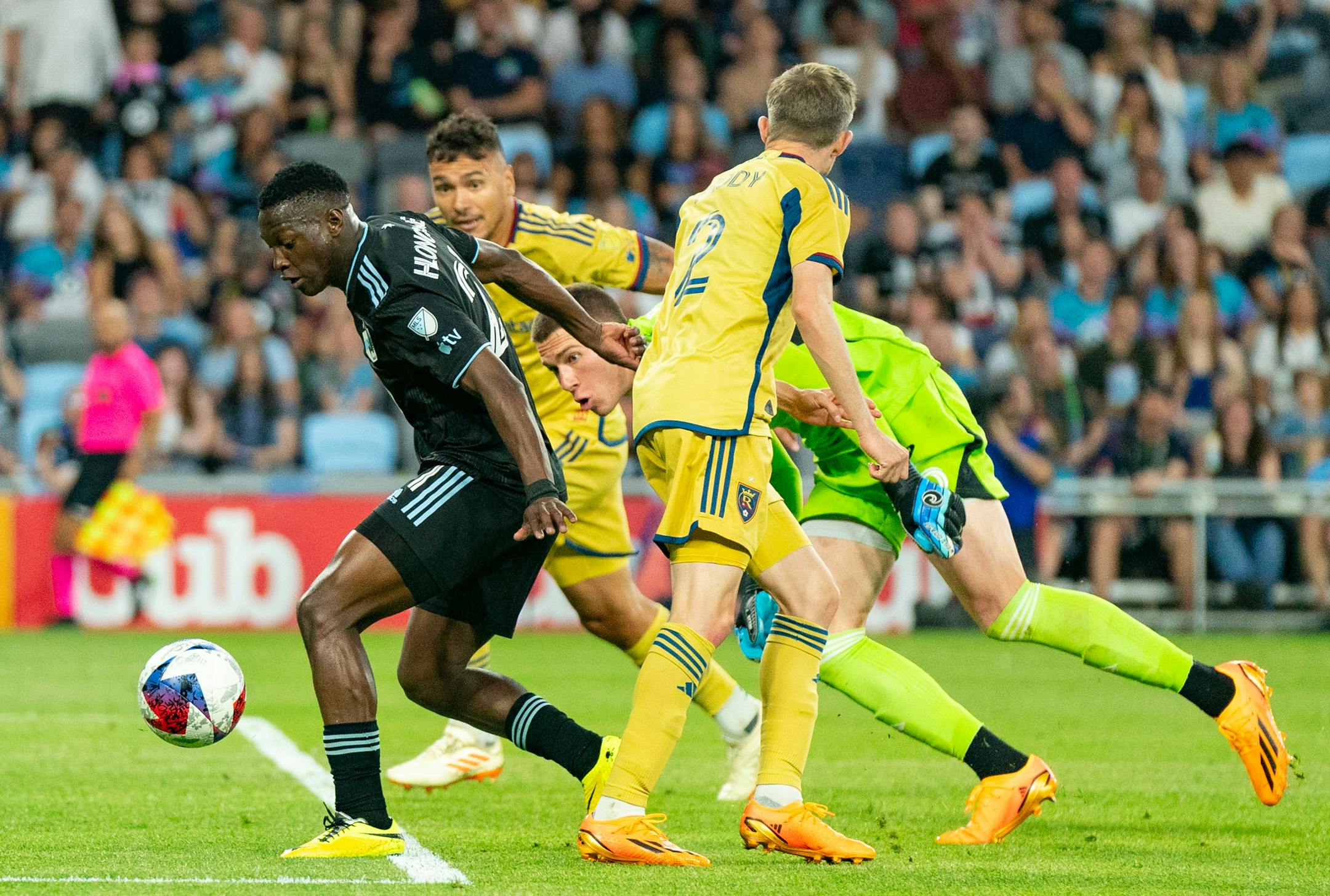 Minnesota United forward Bongokuhle Hlongwane (21) dribbles past Real Salt Lake defender Marcelo Silva (30), goalkeeper Gavin Beavers (35) and defender Andrew Brody (2) before having his shot blocked by Silva in the second half.