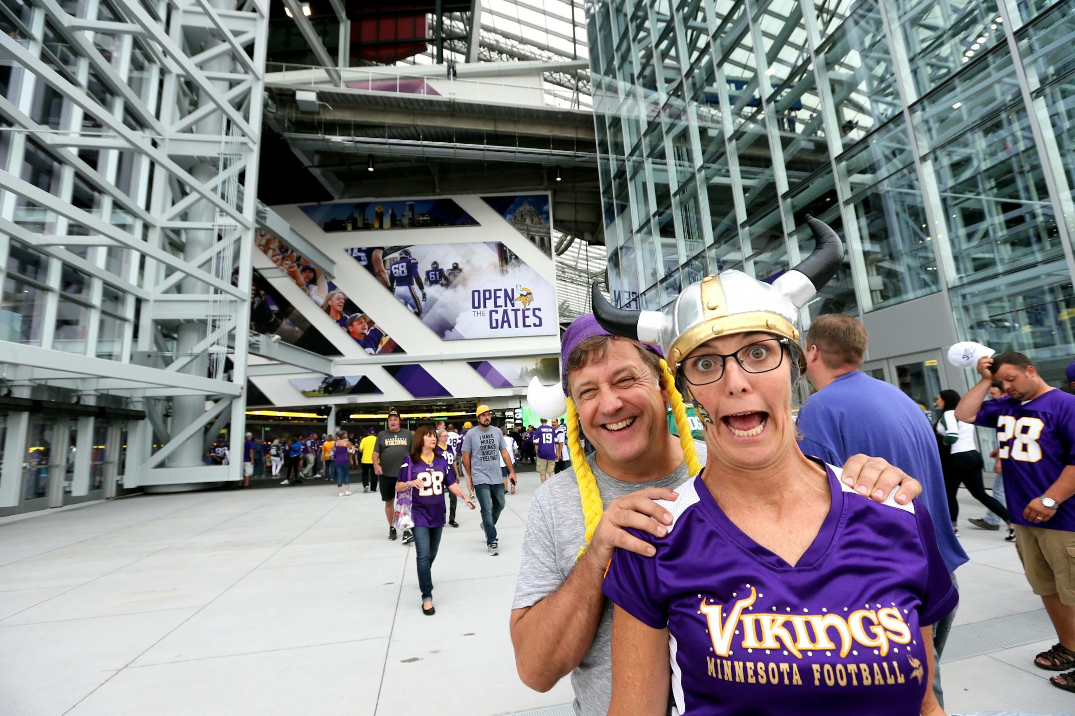 The Minnesota Vikings open the new US Bank Stadium for their first home regular season game against the Green Bay Packers. Here, Todd and Mindi Hansen of Edina, long time Vikings season ticket holders, were quite excited to walk through the front doors of the new US Bank Stadium Sunday afternoon.