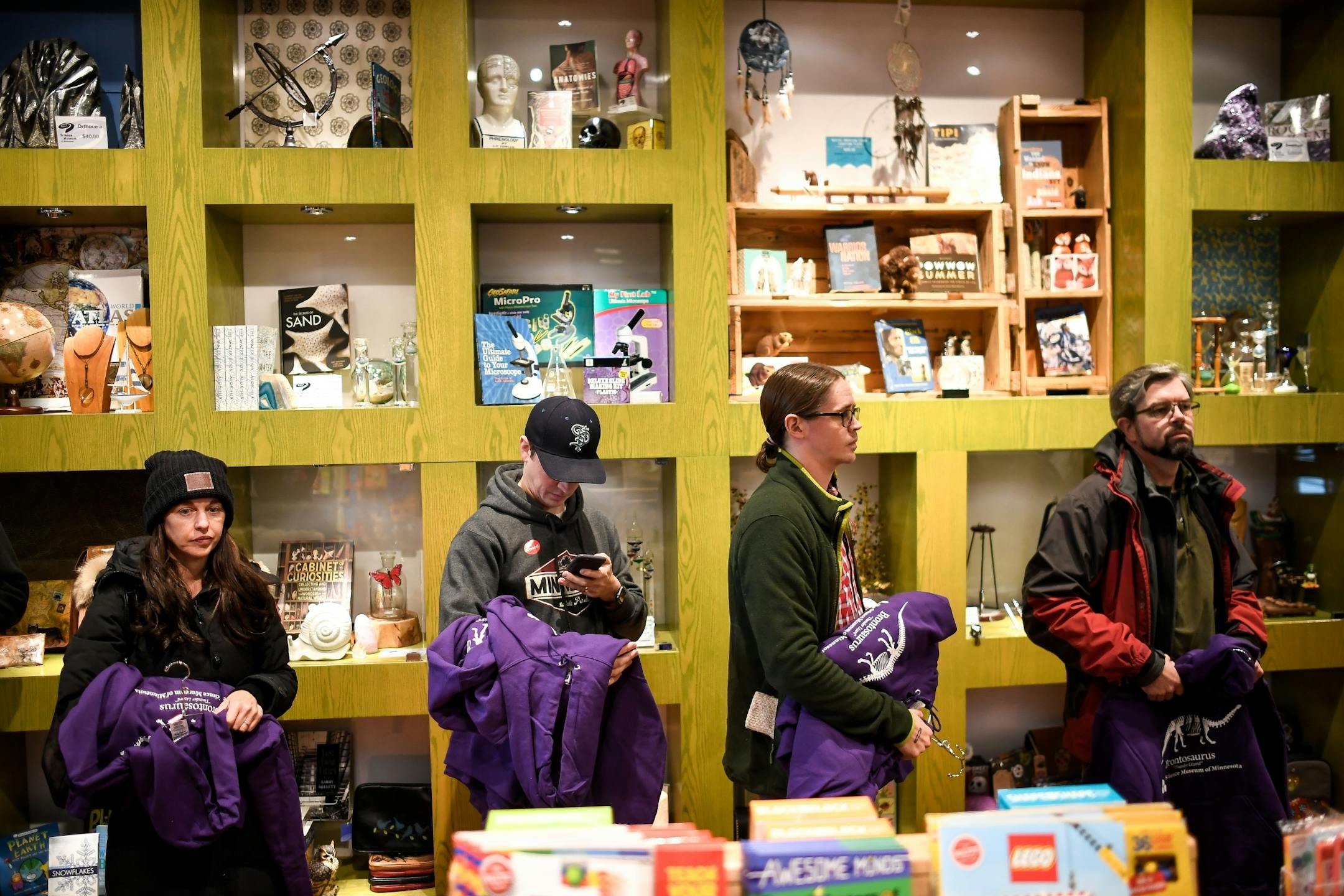 A line began to form Tuesday morning at the Science Museum of Minnesota gift shop as customers purchased brontosaurus hoodies and t-shirts made popular by season two of Stranger Things.