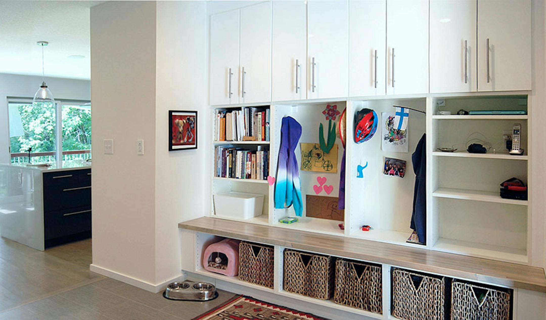 The original kitchen area was turned into a mudroom with plenty of built-in storage for the family.