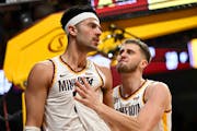 Minnesota Gophers forward Dawson Garcia (3) and forward Parker Fox (23) celebrate an and-one opportunity by Garcia in the second half Monday, Jan. 15,