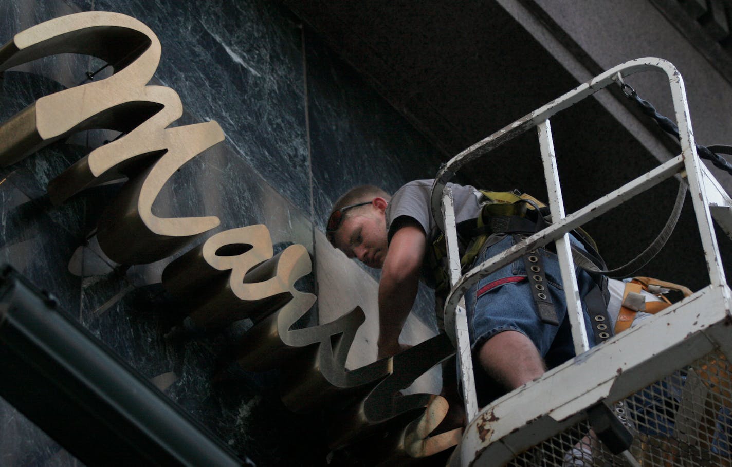 Brian Godfrey from All-Brite Sign took down a Marshall Field's sign in downtown Minneapolis after the department store was replaced by Macy's after the chain was sold in 2006.