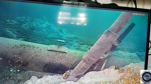 This June 2020 photo, shot from a television screen provided by the Michigan Department of Environment, Great Lakes, and Energy shows damage to anchor support EP-17-1 on the east leg of the Enbridge Line 5 pipeline within the Straits of Mackinac in Michigan. Enbridge who provided the photos to the state of Michigan, last week said an anchor support on the east leg of the pipeline, right, had shifted. A judge has shut down the pipeline in Michigan's Great Lakes, granting a request from the state.