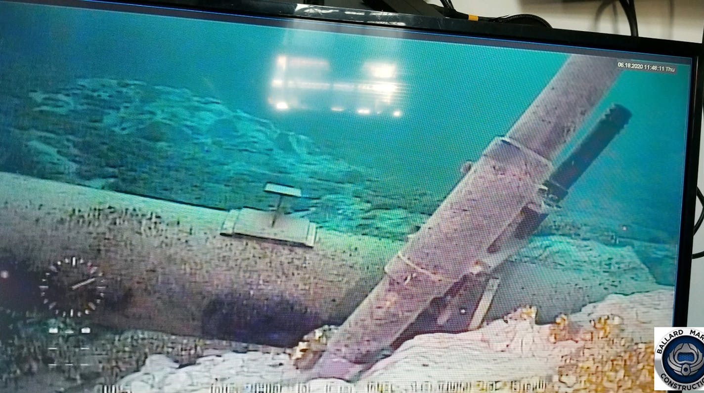 This June 2020 photo, shot from a television screen provided by the Michigan Department of Environment, Great Lakes, and Energy shows damage to anchor support EP-17-1 on the east leg of the Enbridge Line 5 pipeline within the Straits of Mackinac in Michigan. Enbridge who provided the photos to the state of Michigan, last week said an anchor support on the east leg of the pipeline, right, had shifted. A judge has shut down the pipeline in Michigan's Great Lakes, granting a request from the state.
