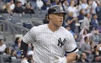 New York Yankees' Aaron Judge rounds the bases with a home run during the fourth inning of a baseball game against the Toronto Blue Jays, Saturday, Se