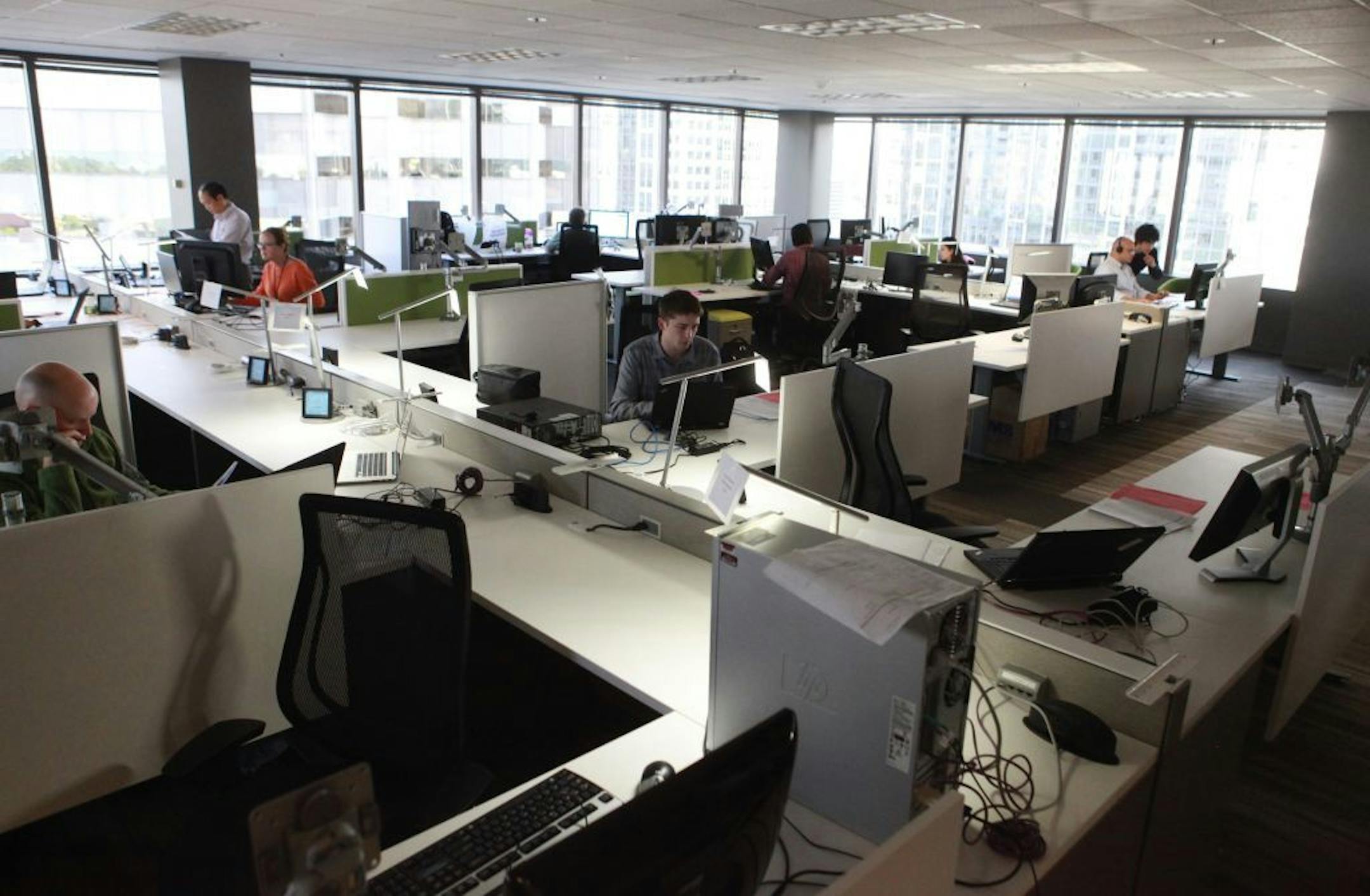 Software engineers work in Bellevue, Washington, at Caradigm, a joint health venture between Microsoft and GE.