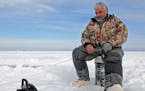 Dick "Griz" Gryzwinski fishes for walleyes and perch in Mille Lacs on January 20, 2010.