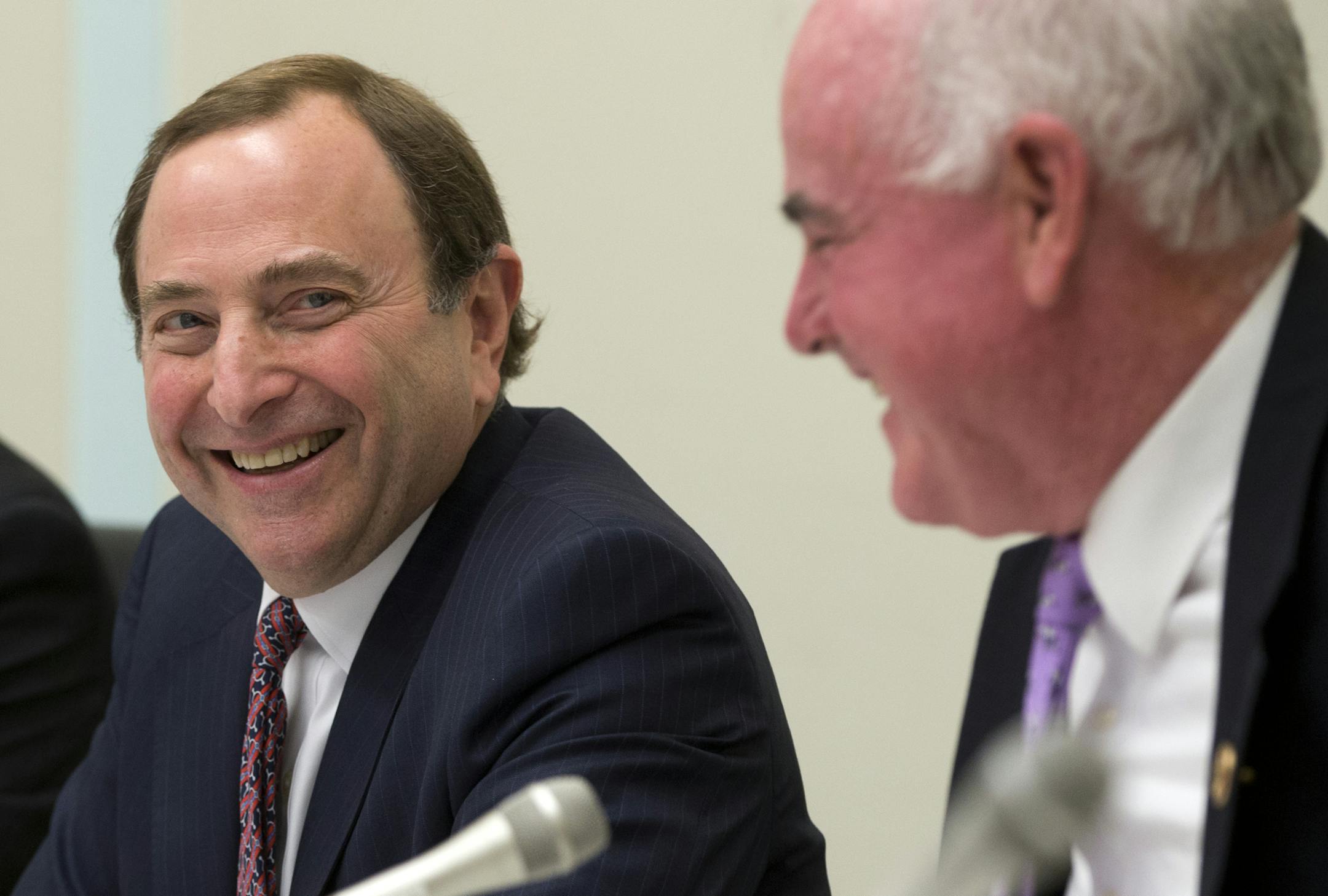 NHL Commissioner Gary Bettman, left